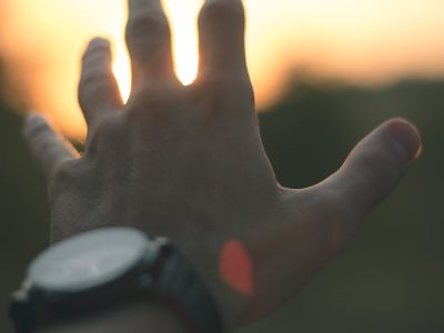 photo of person reaching out his hand