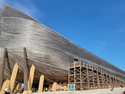 a large wooden boat sitting on top of a beach