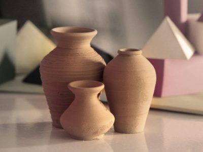 three brown clay vases