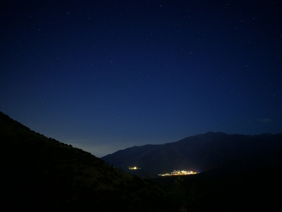 silhouette of mountain under blue sky during night time